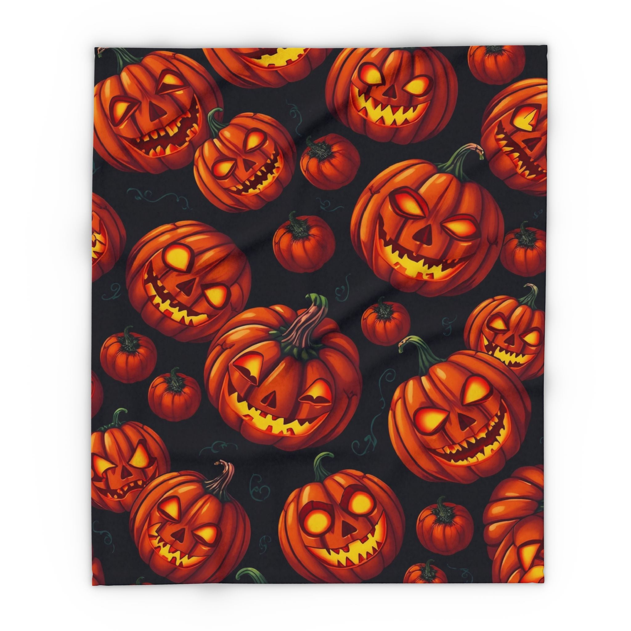 Fleece blanket featuring a halloween pattern of spooky pumpkin lanterns on a dark background.